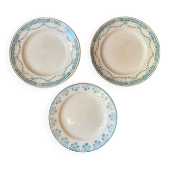 3 flat plates in ironstone with a floral green border.