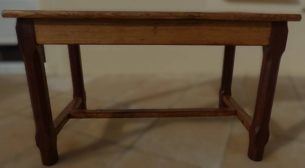 Oak farmhouse table with legs joined by a spacer