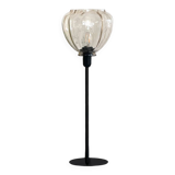 Table lamp with an antique star-shaped globe and a black base