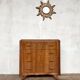 Art Deco vintage commode with tapered legs.