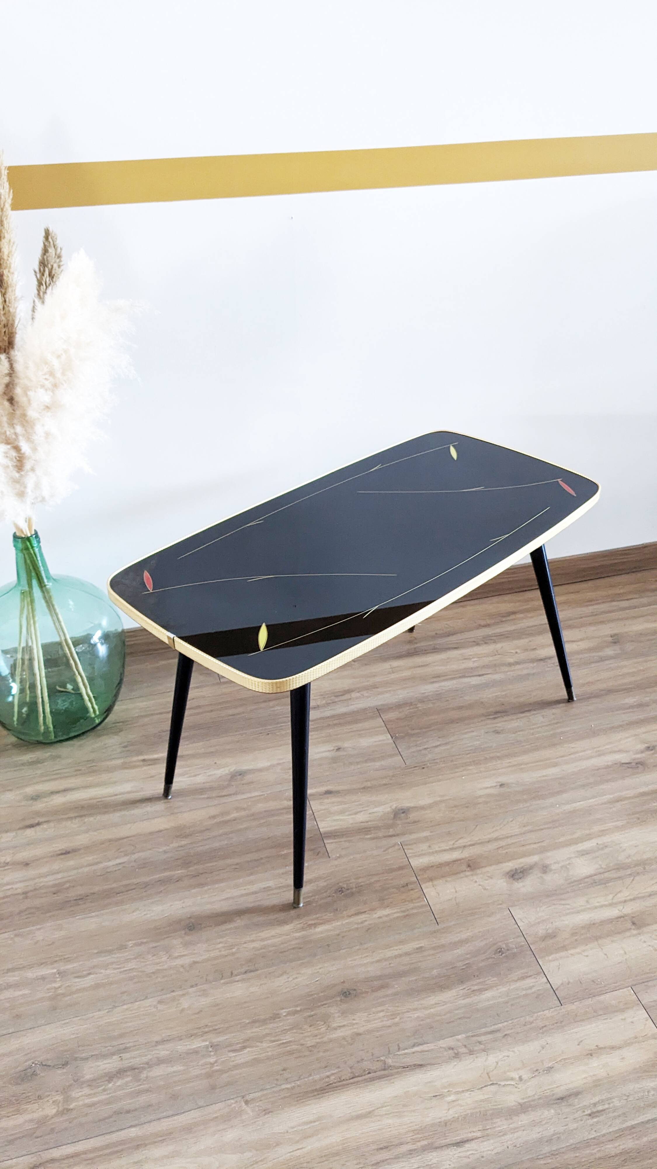 Glass coffee table with spindle legs