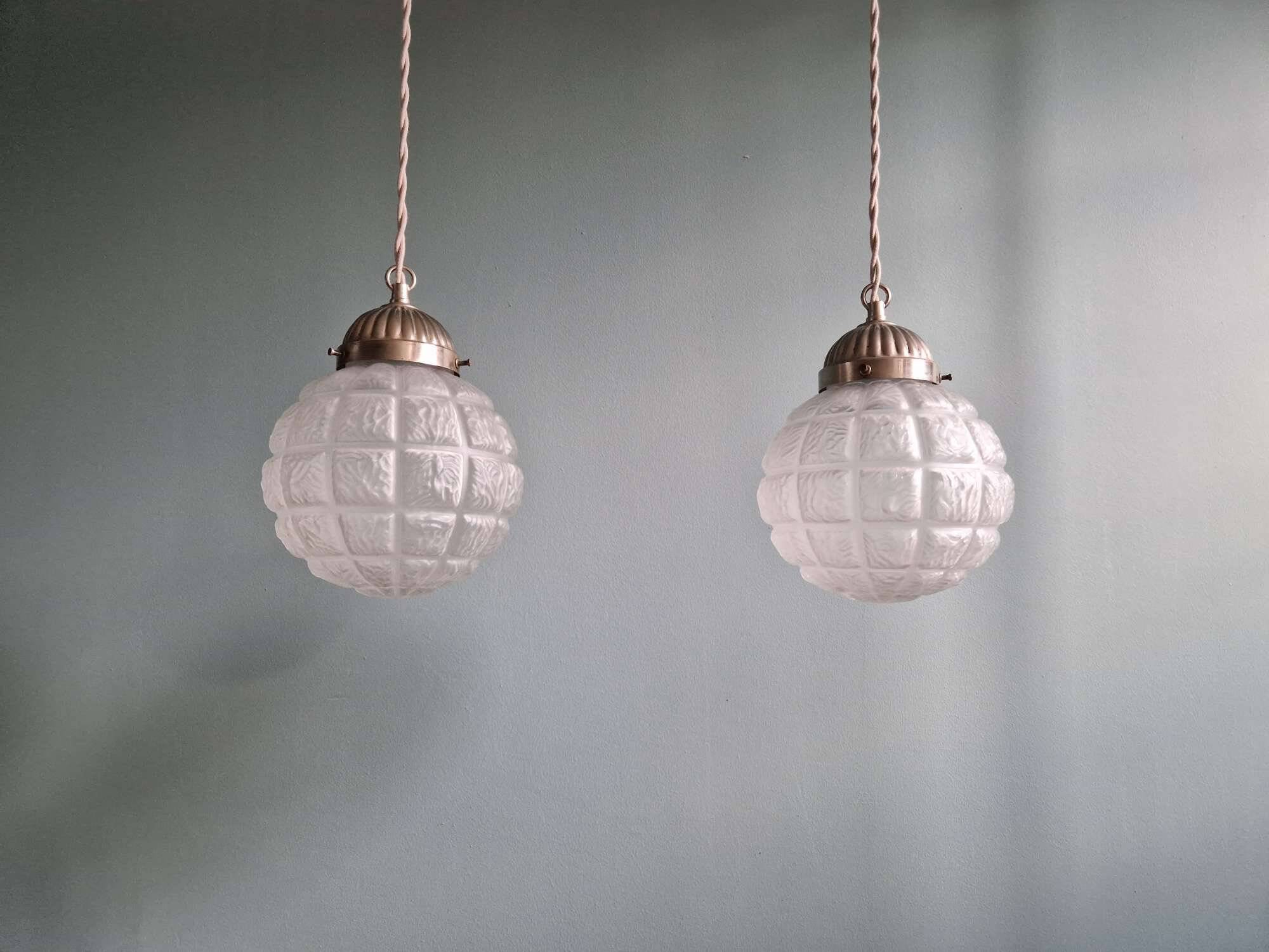 Pair of Art Deco frosted glass pendants, 1920s-30s.