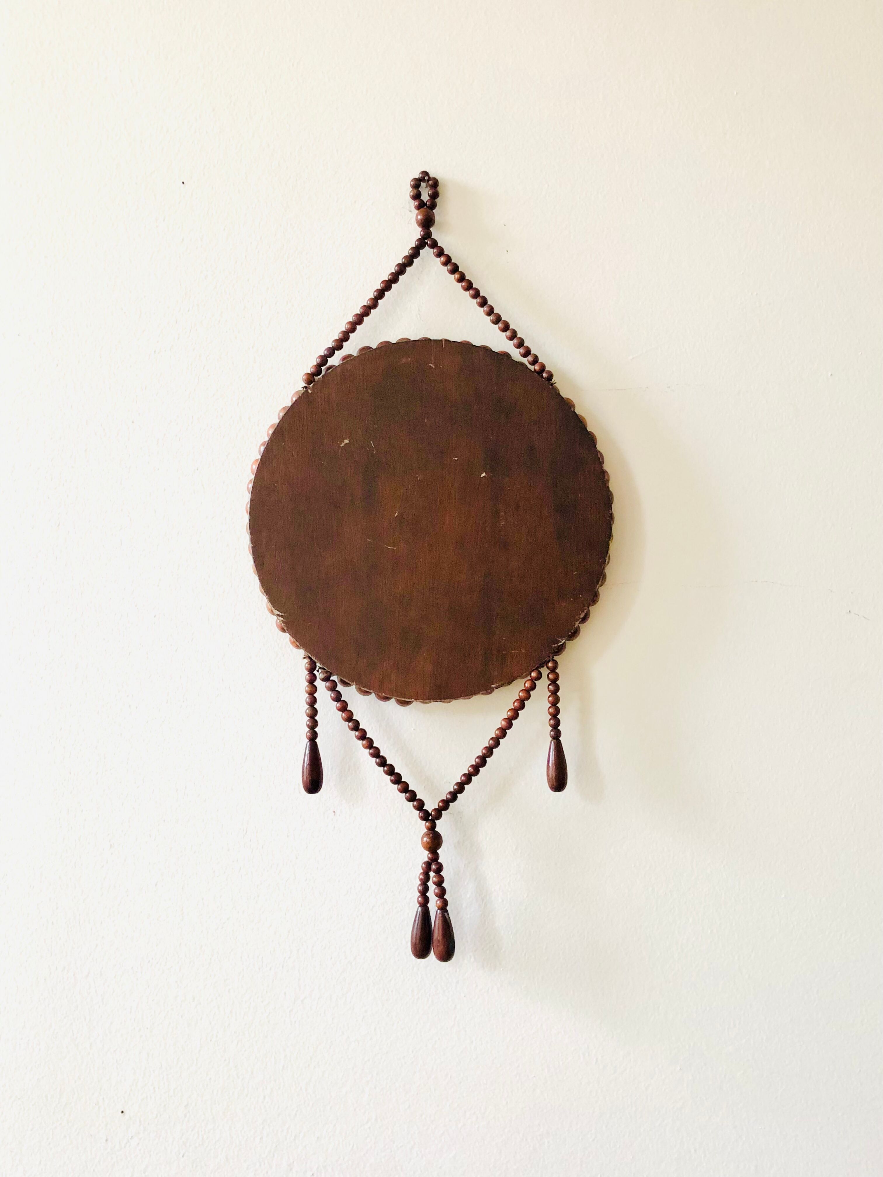 Miroir mural vintage en perles de bois
