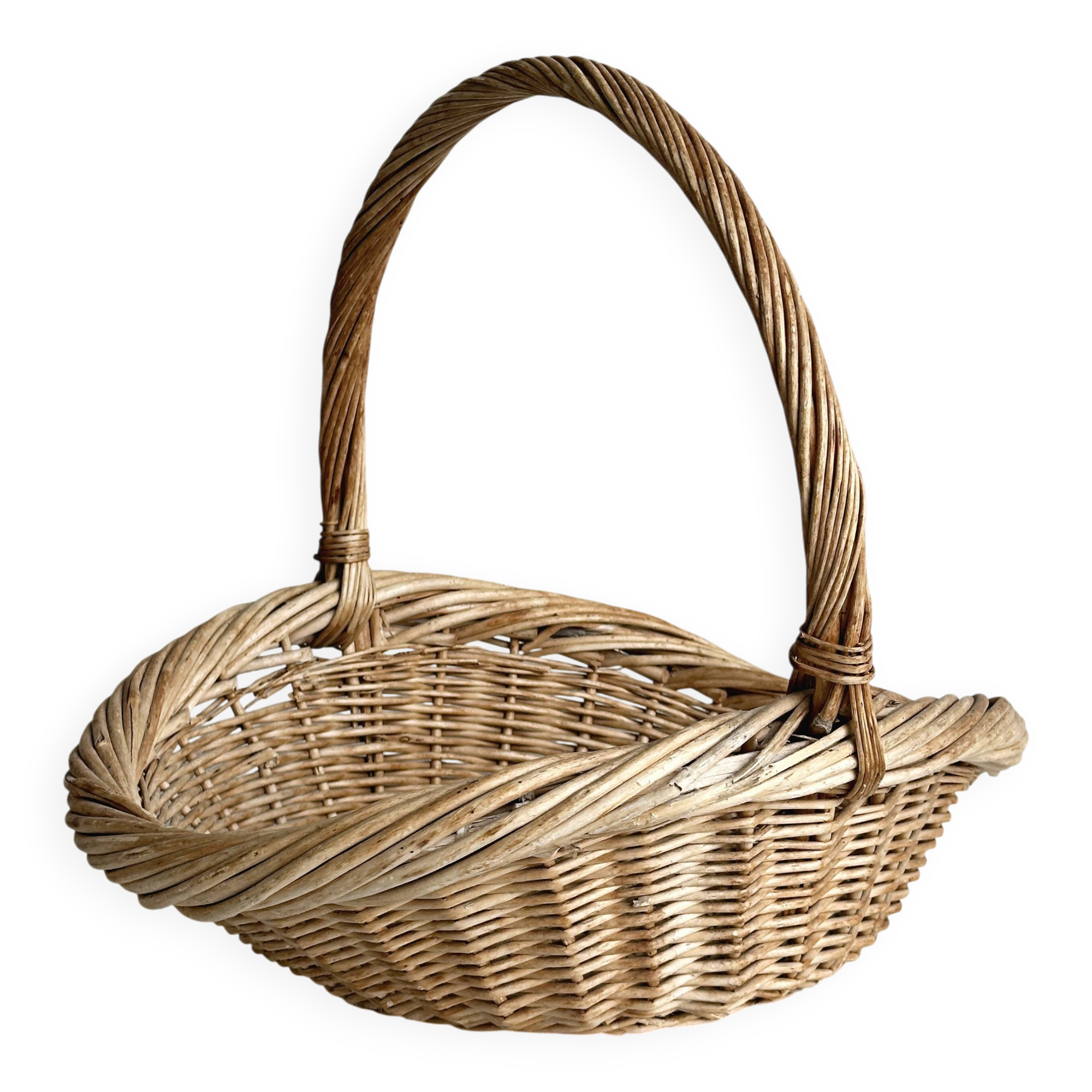 Large antique woven wicker basket with handle.