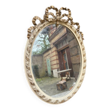 Small old oval gilded mirror