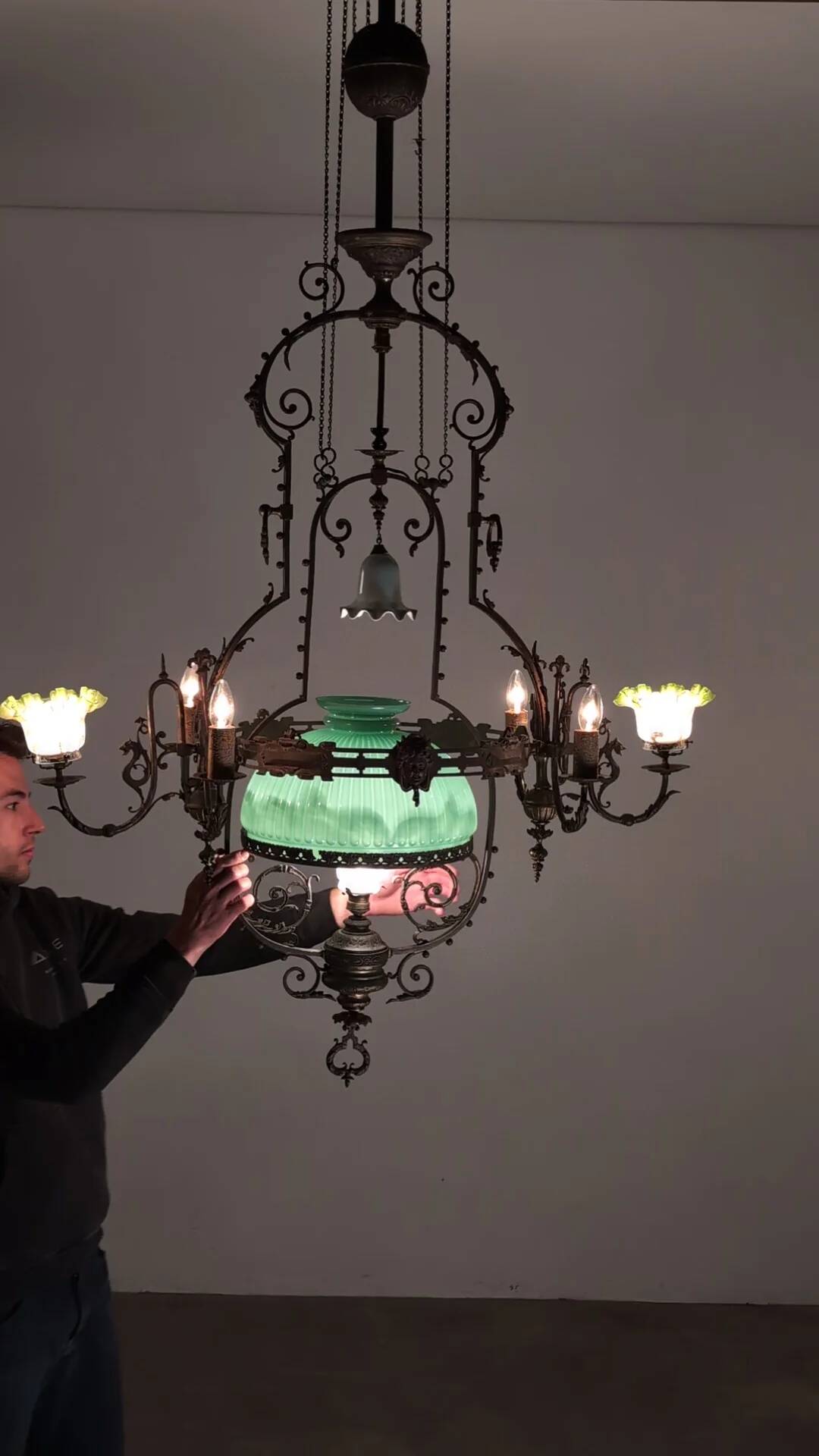 Antique adjustable height chandelier with original glasswork and brass detailing