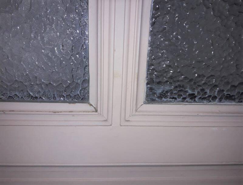 Large glazed door and its old glazed transom.