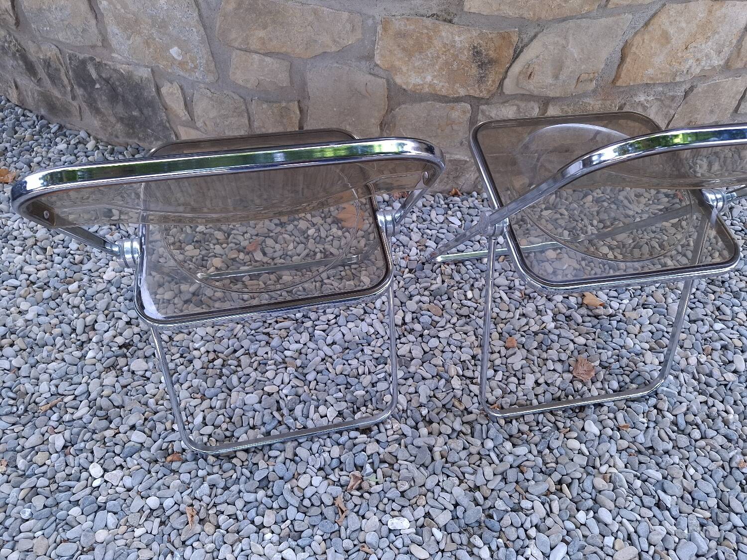 2 folding chairs designed by Giancarlo Piretti for Castelli