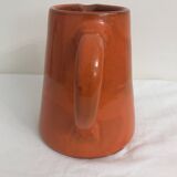 Orange glazed ceramic pitcher