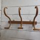 Curved wooden coat rack with 3 hooks, 1920s.
