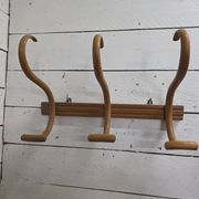 Curved wooden coat rack with 3 hooks, 1920s.