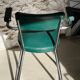 Pair of green vinyl and chrome armchairs, mid-century