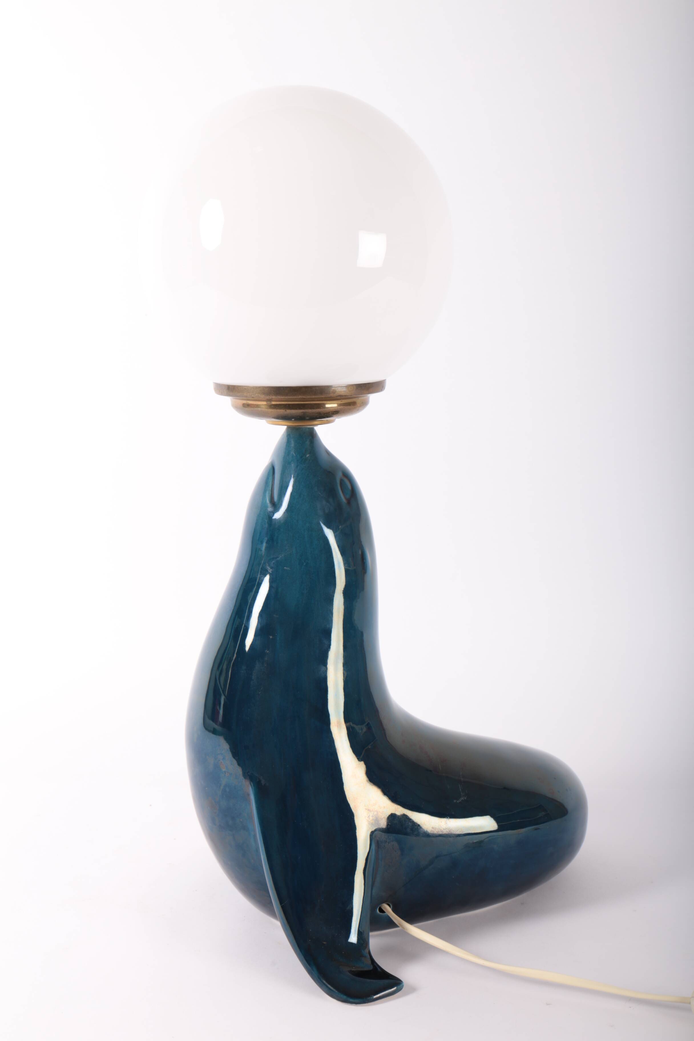 Blue ceramic sea lion lamp