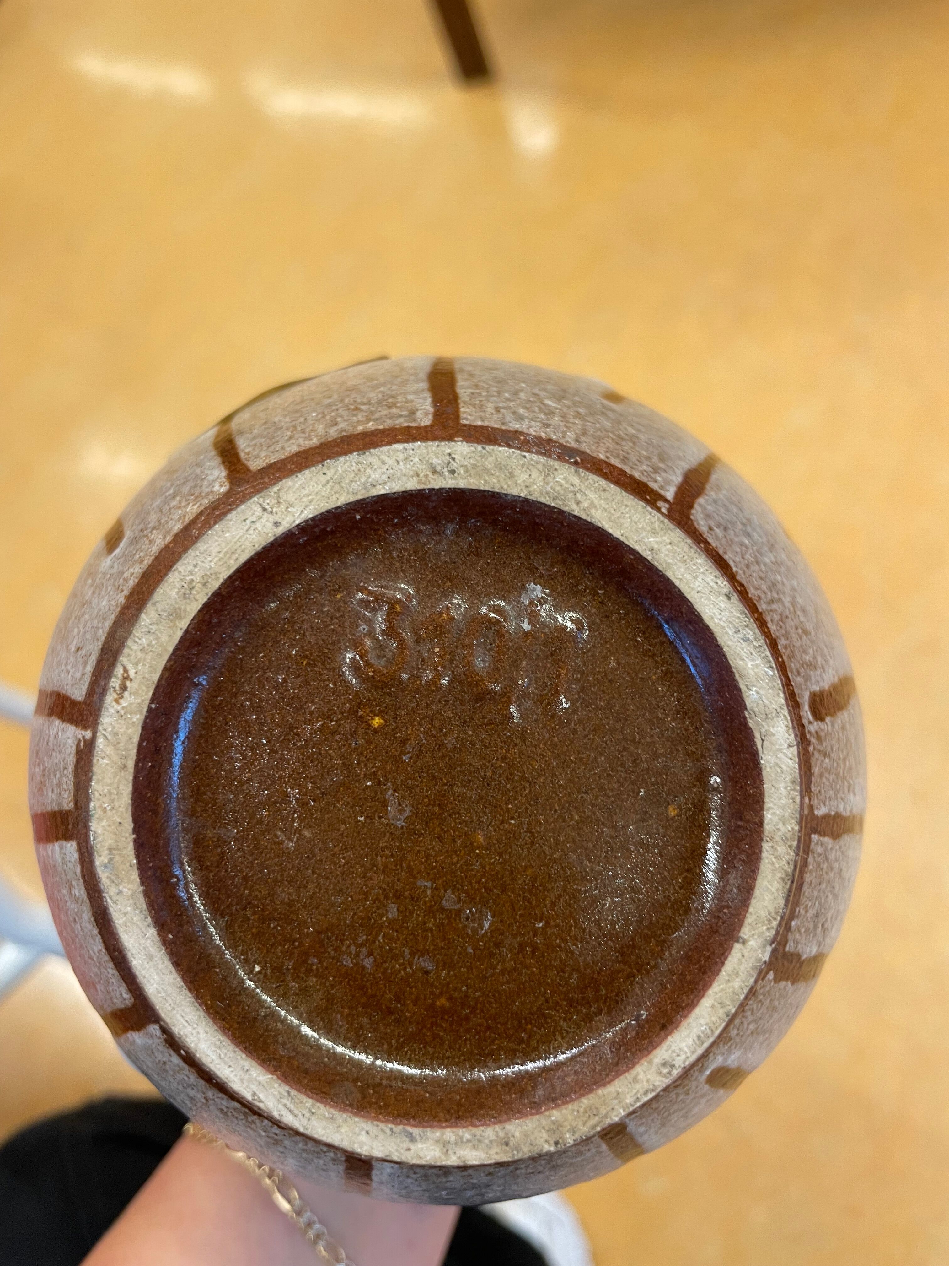 White vintage vase or pitcher with brown lines