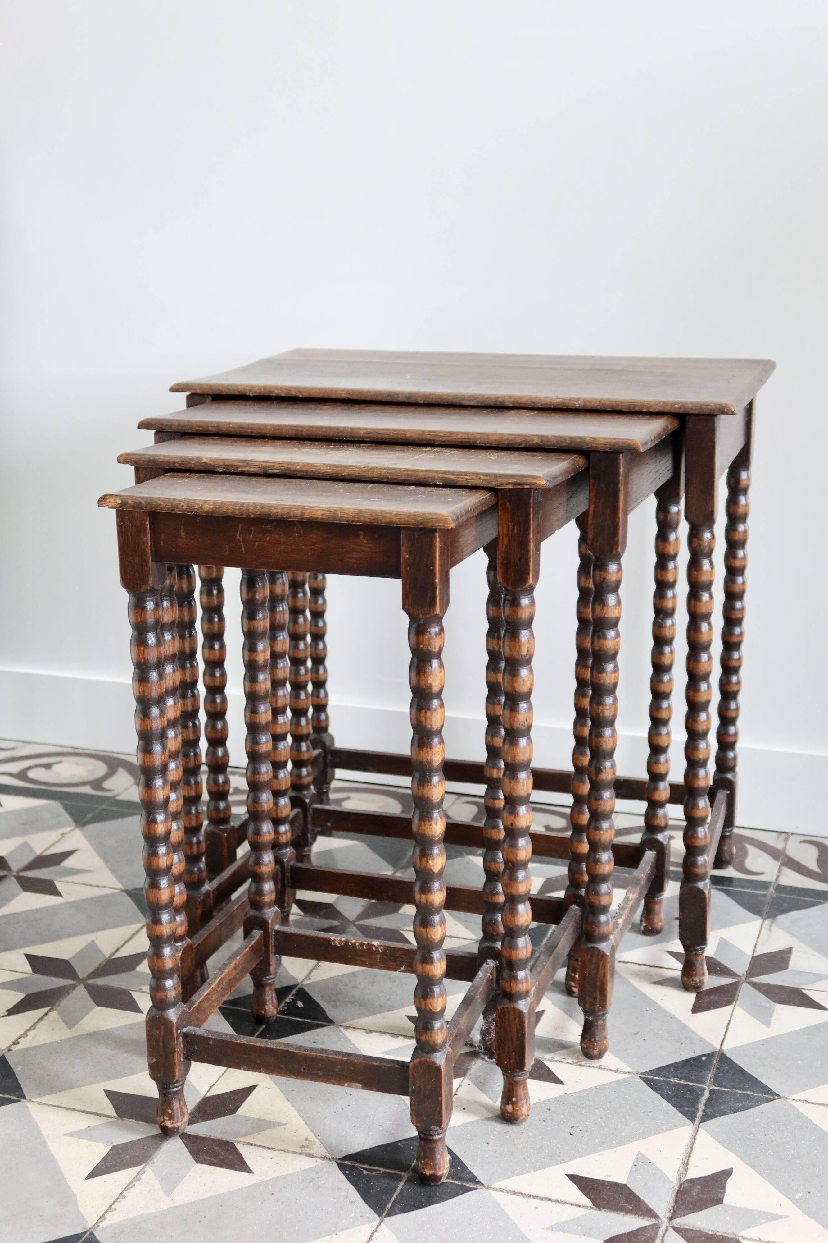 4 antique nesting tables made of turned wood
