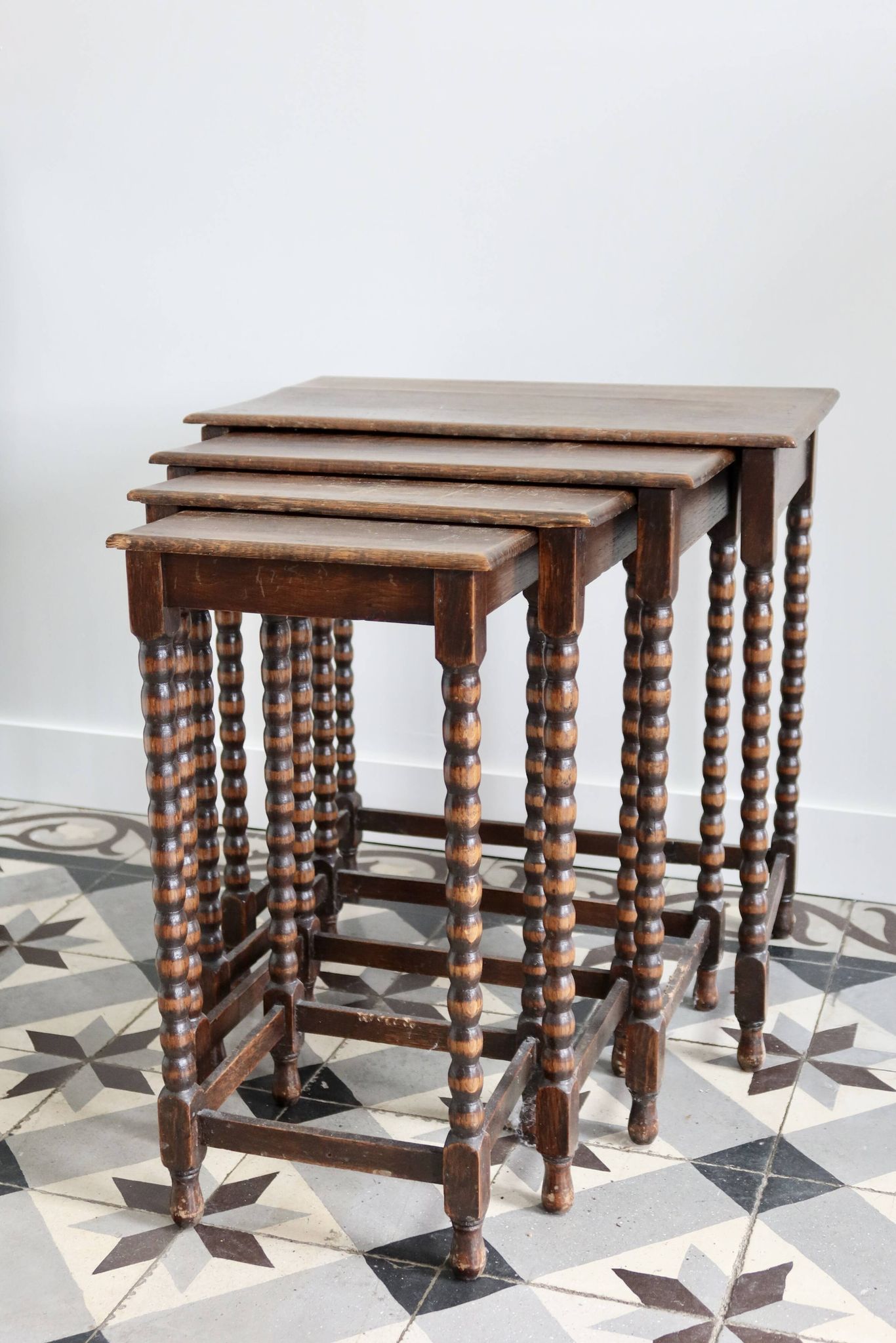 4 antique nesting tables made of turned wood