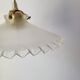 Serrated opaline suspension
