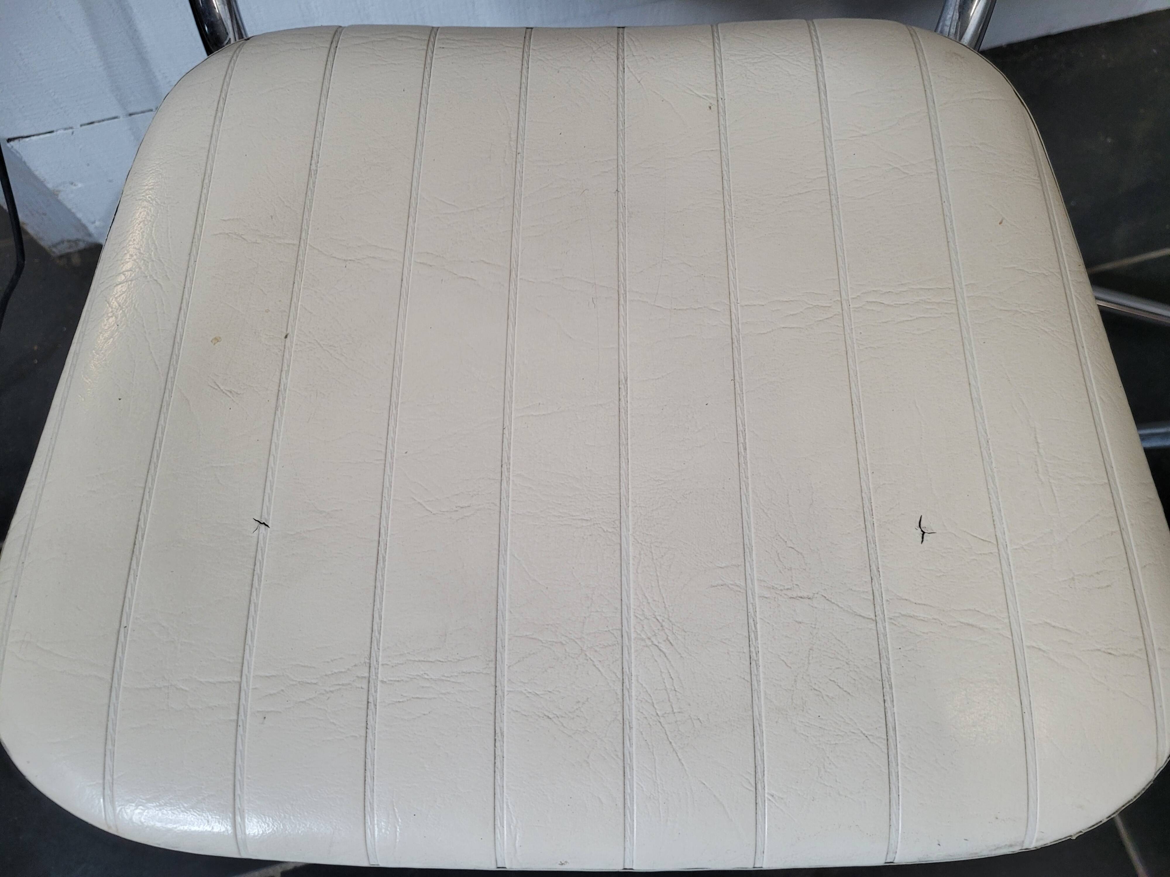 4 chrome foot chairs on top in Skaï from the 60s/70s