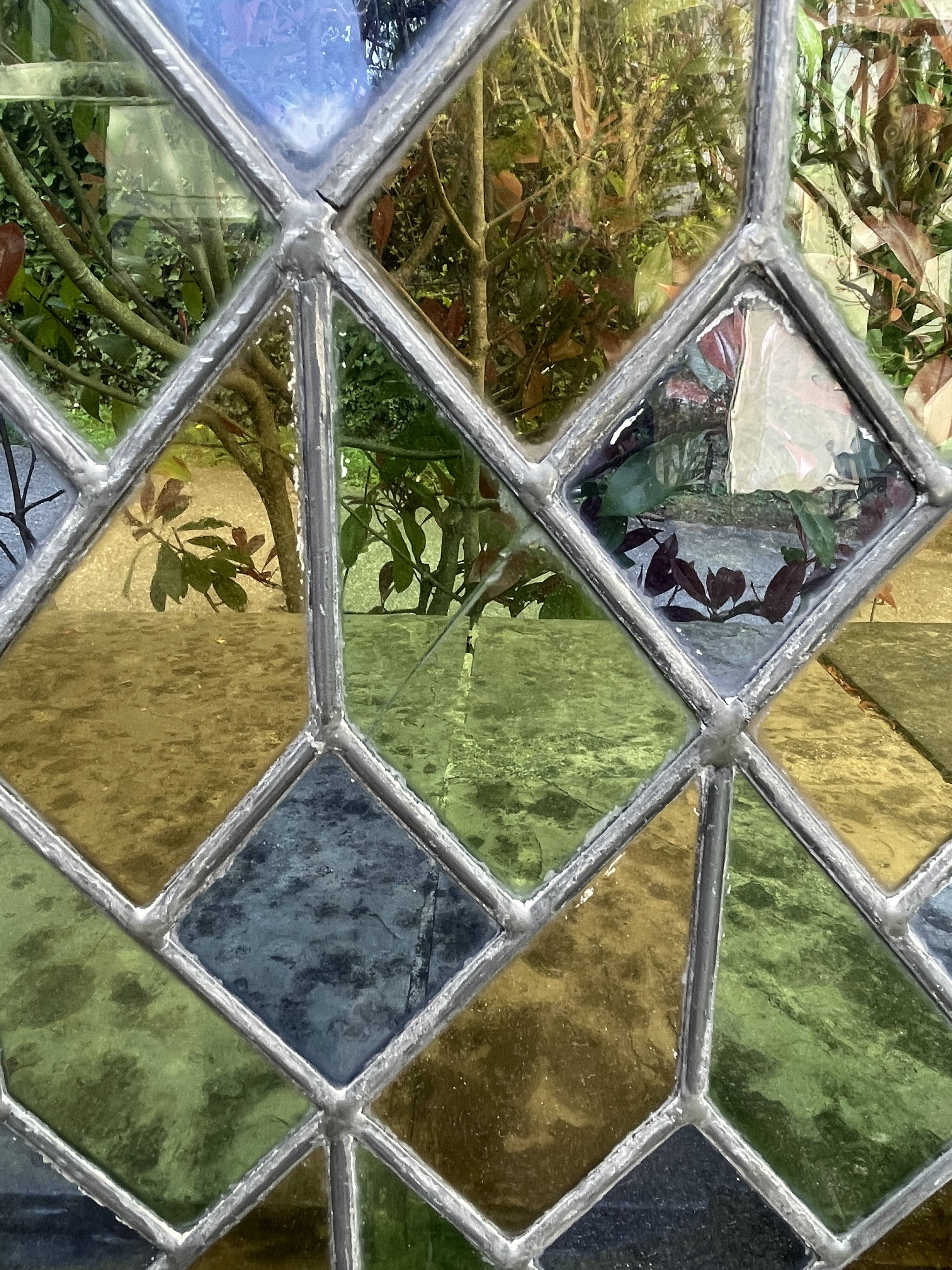 Pair of old double stained glass doors. Metal frames. Stained glass windows