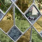 Pair of old double stained glass doors. Metal frames. Stained glass windows