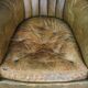 Green antique barrel back wingback chair on wheels
