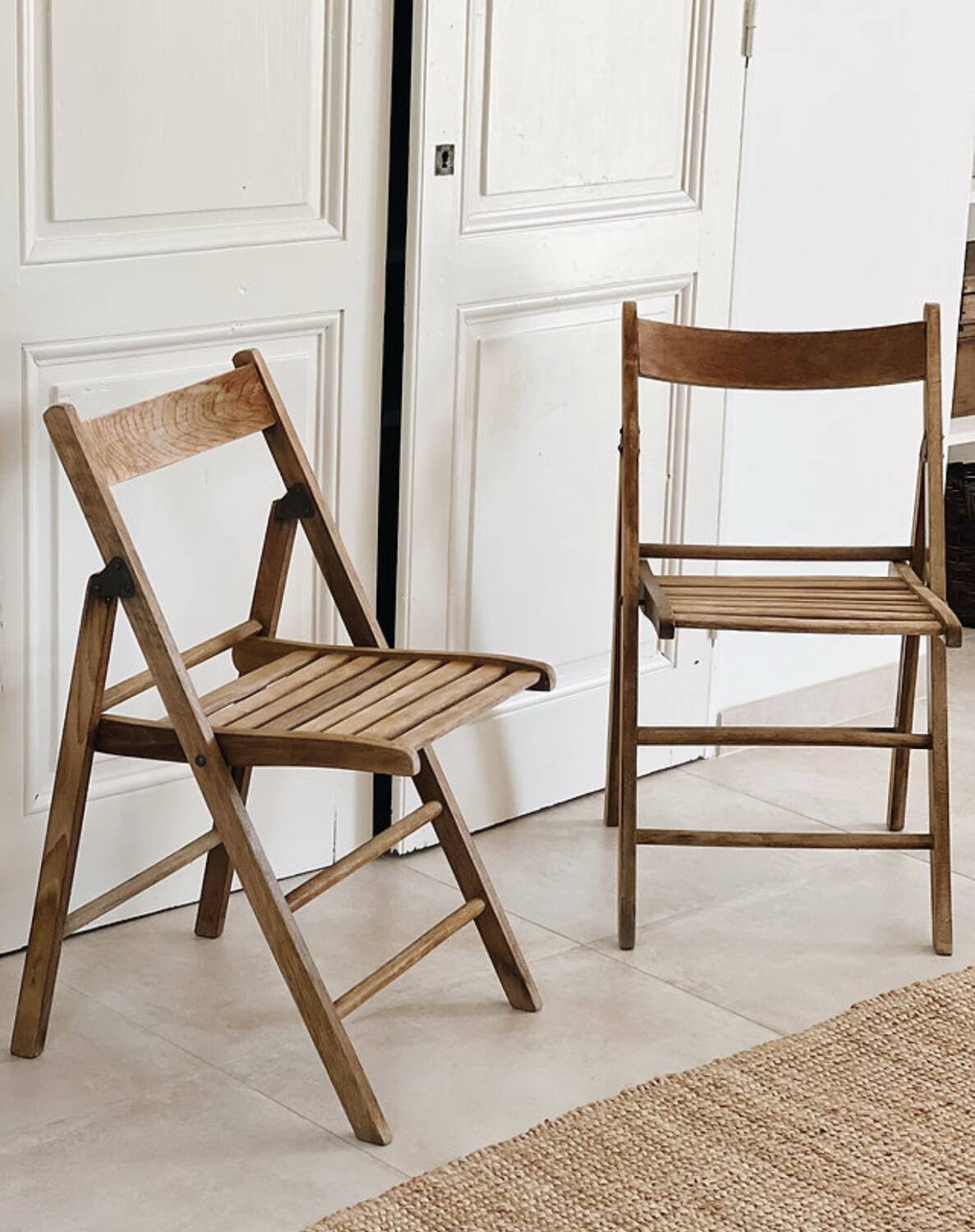 Pair of folding wooden chairs