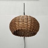 Mid-century modern Danish extendable cantilever wall lamp with a rattan shade, 1960s.