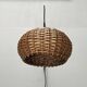 Mid-century modern Danish extendable cantilever wall lamp with a rattan shade, 1960s.