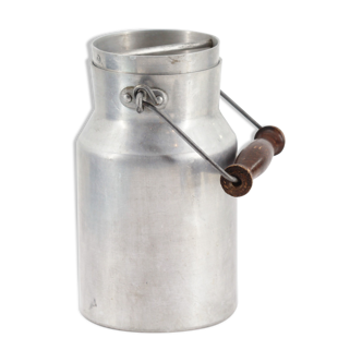 Old metal milk jar