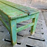 Old wooden bench sidetable green