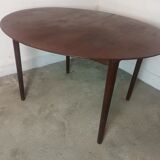 Scandinavian extendable round dining table in teak