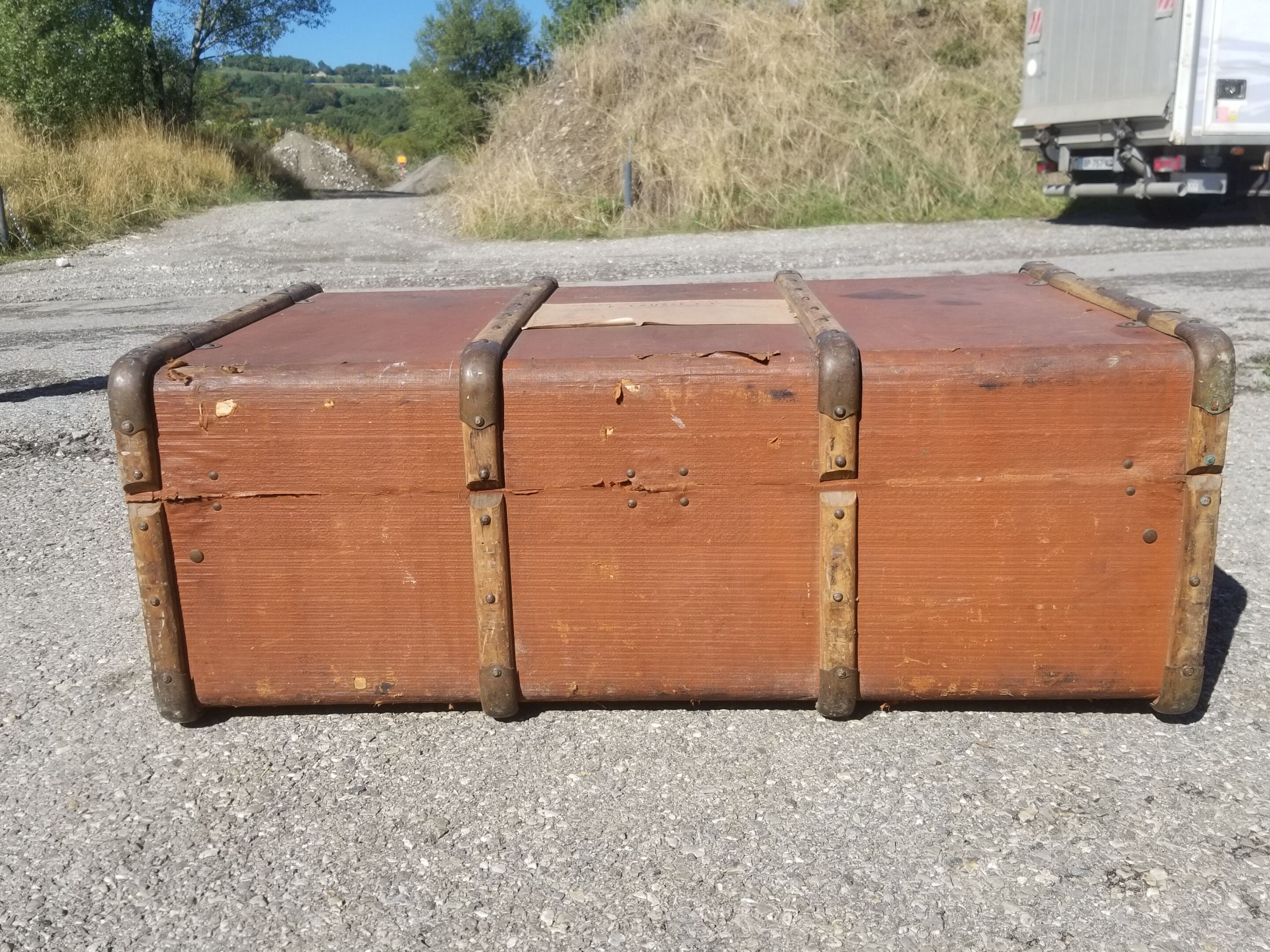 Old travel trunk made of wood and brass