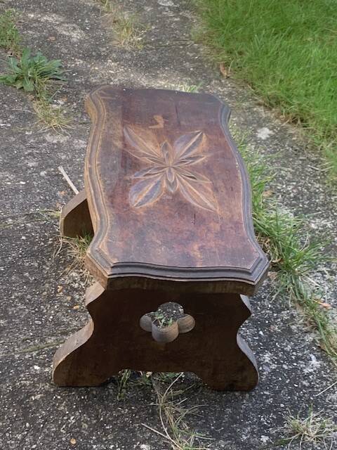 Bench in carved and varnished wood, mountain chalet decoration, old
