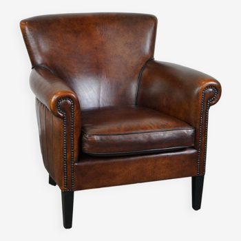 Stylish sheepskin leather armchair with a refined appearance