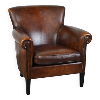 Stylish sheepskin leather armchair with a refined appearance