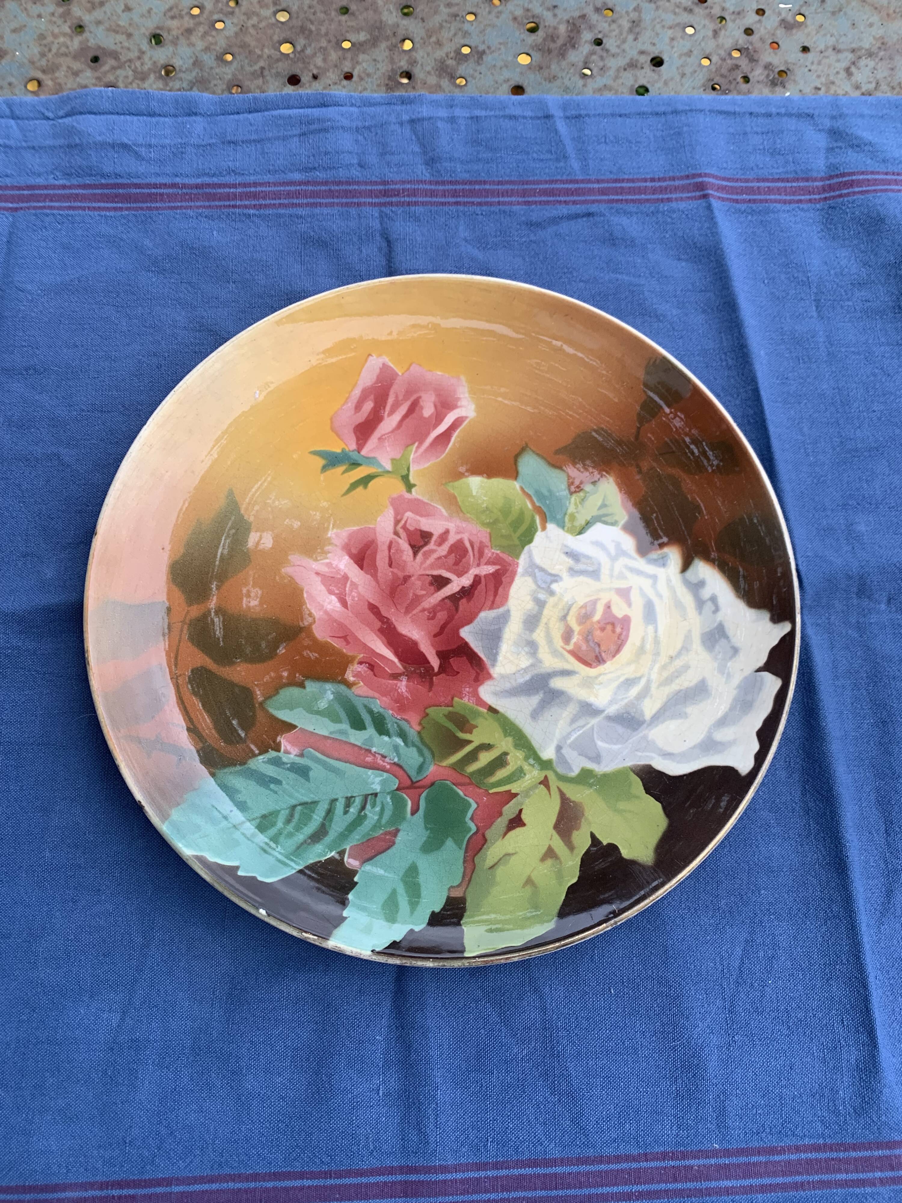 Plate with iron rose motifs, hb, Choisy le roi art deco
