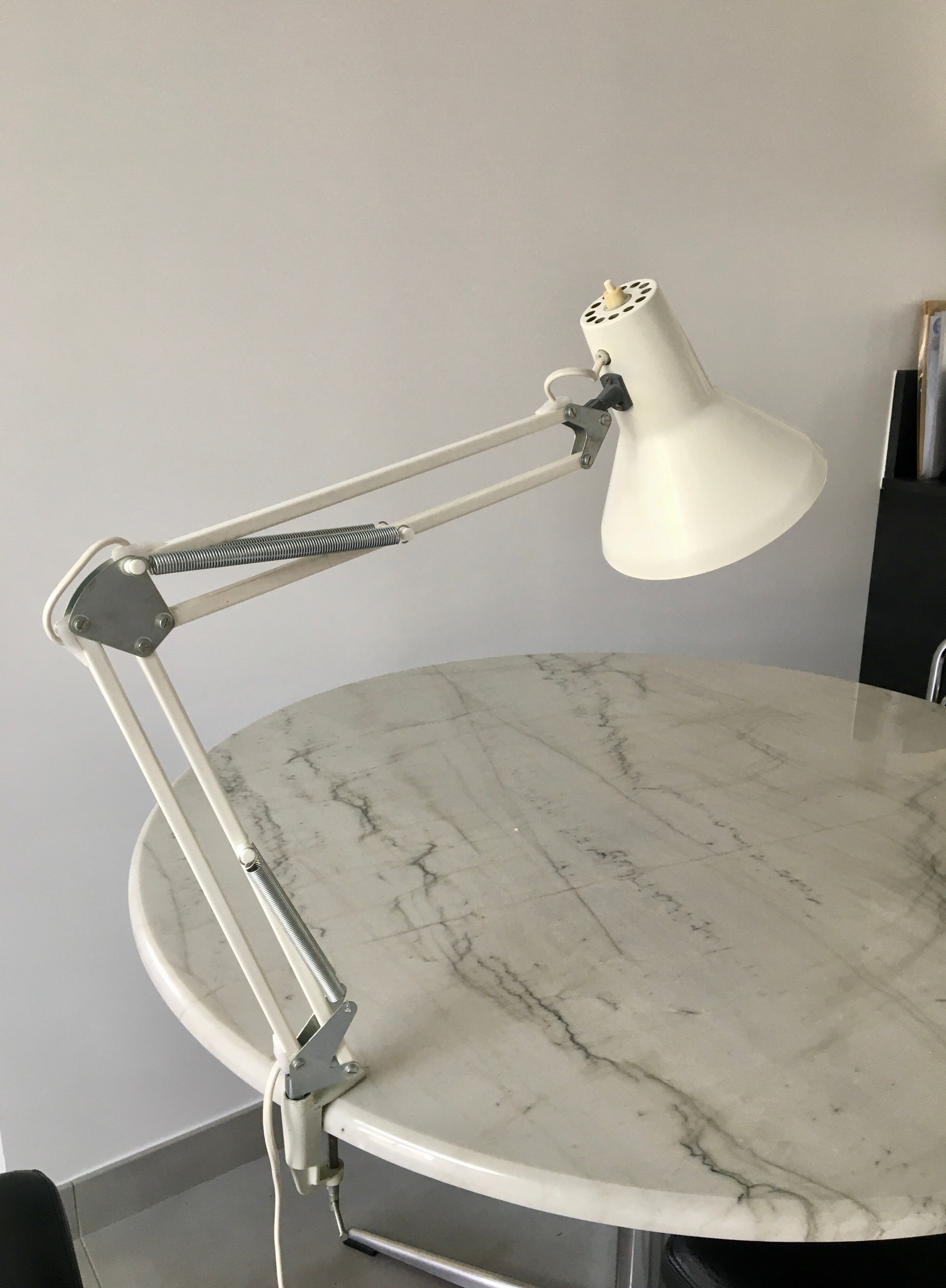 Off-white articulated architect lamp.