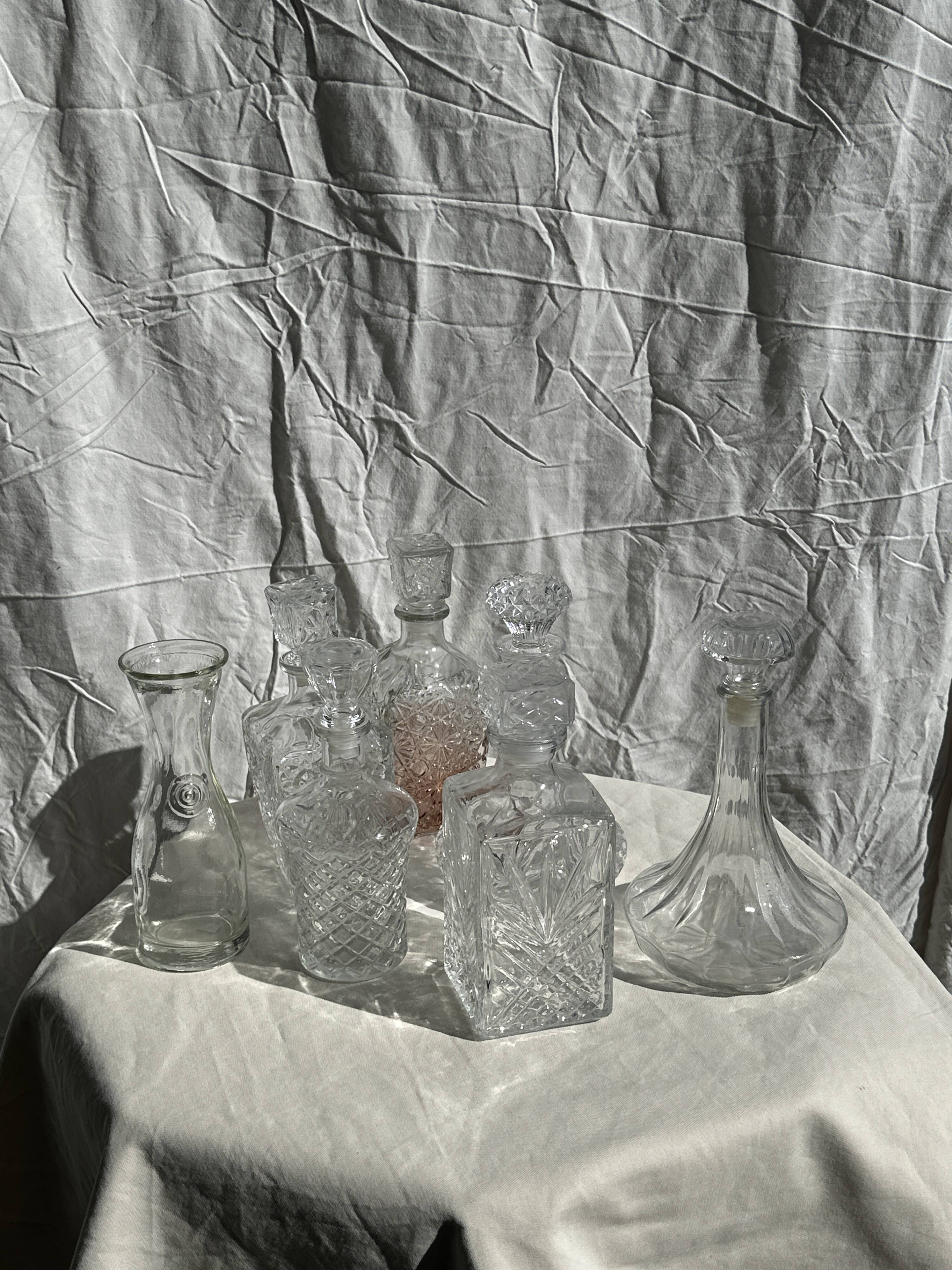 Small cylindrical glass whiskey decanter H:23