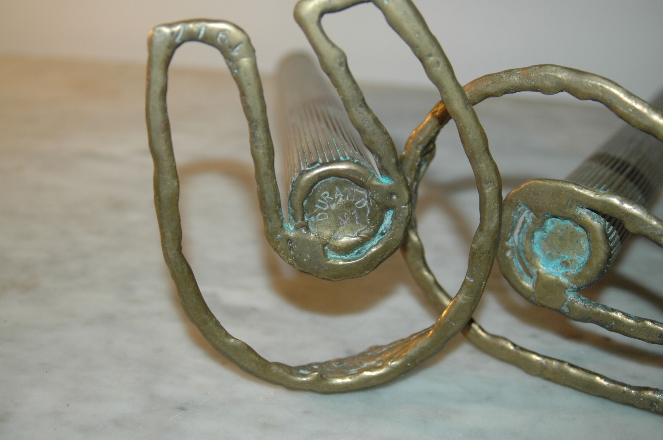 2 horseshoe candlesticks in solid brass  signed Durand