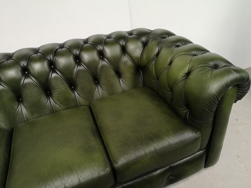 Three-seater green leather Chesterfield sofa