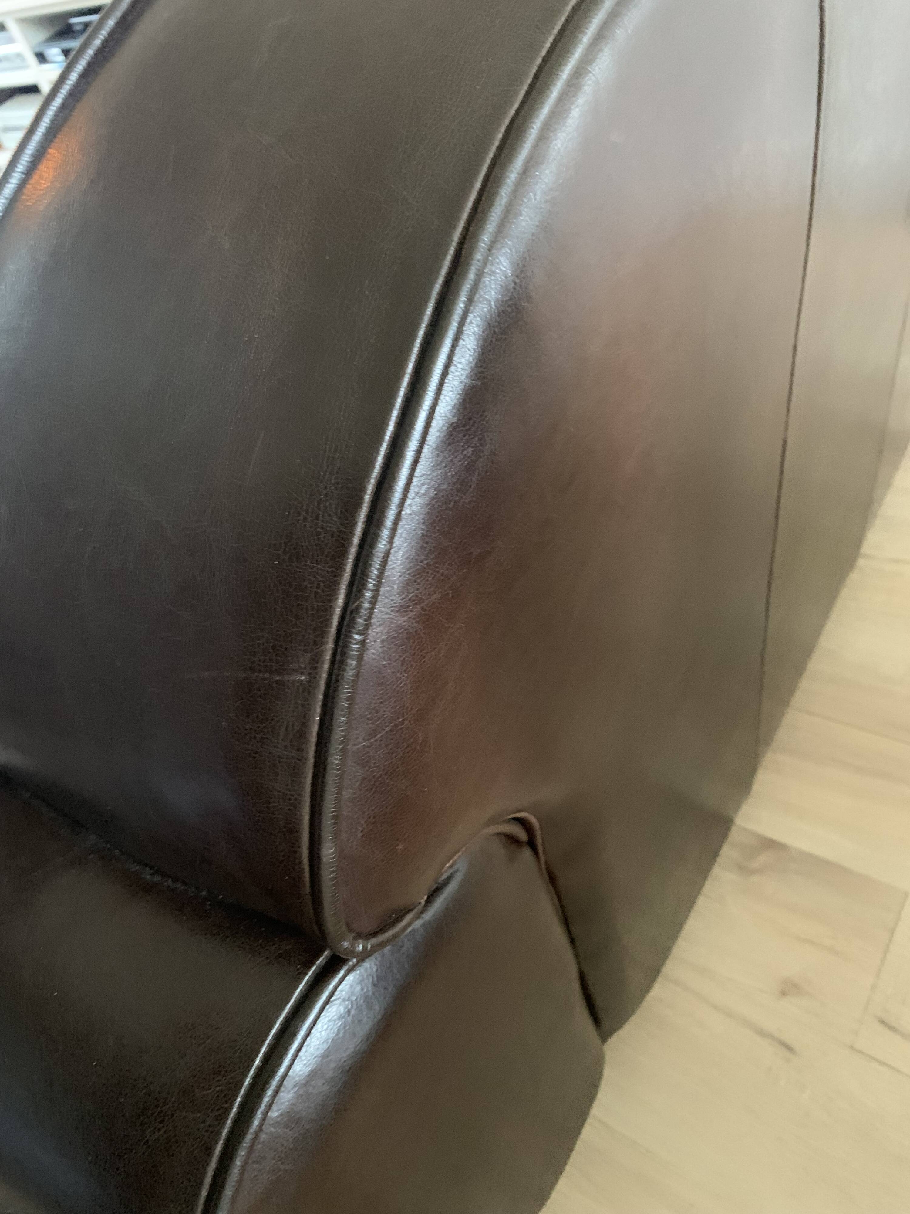 Brown leather club sofa