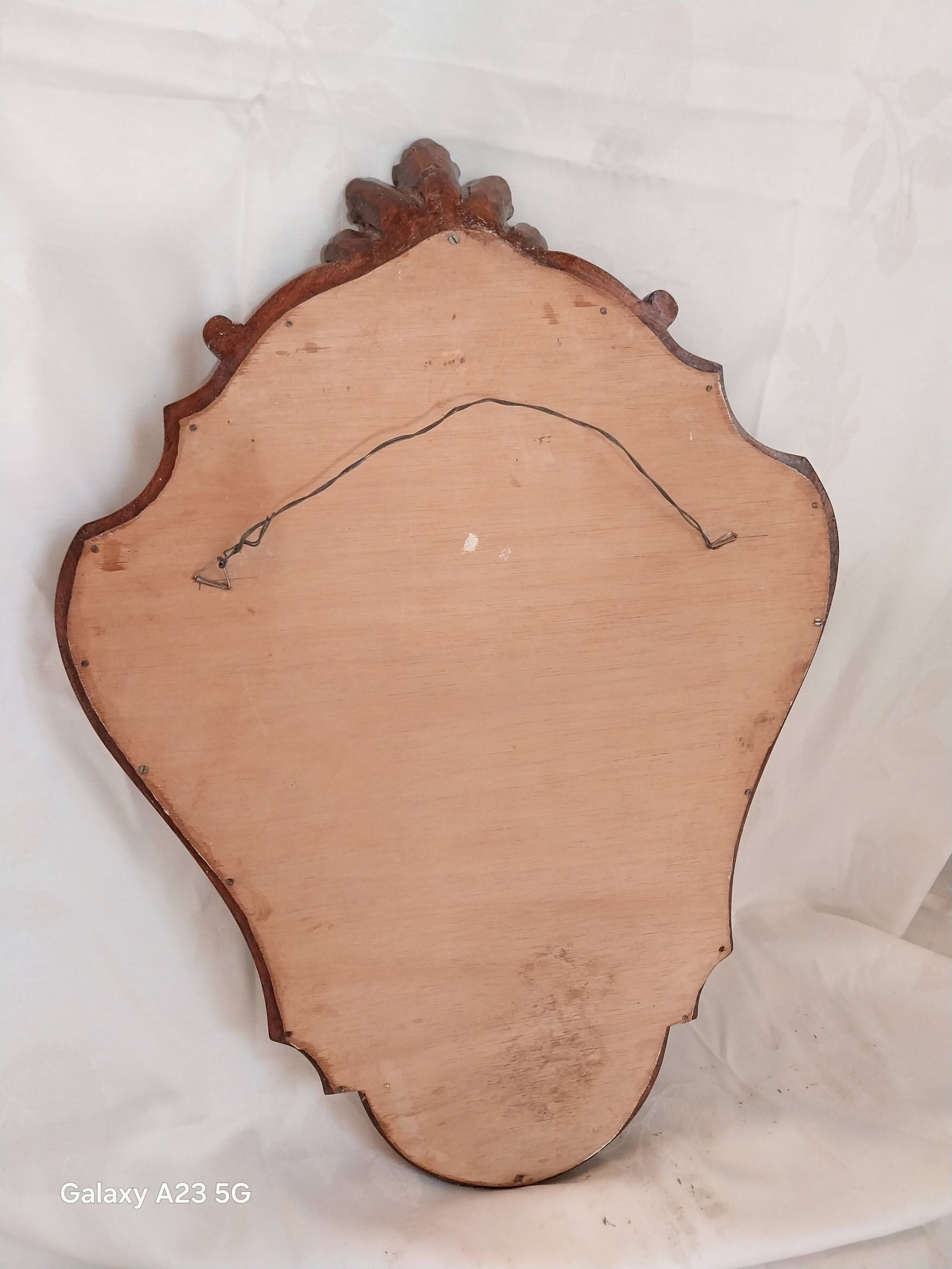 Louis XV style mirror, carved in polished solid wood. Shell pediment.