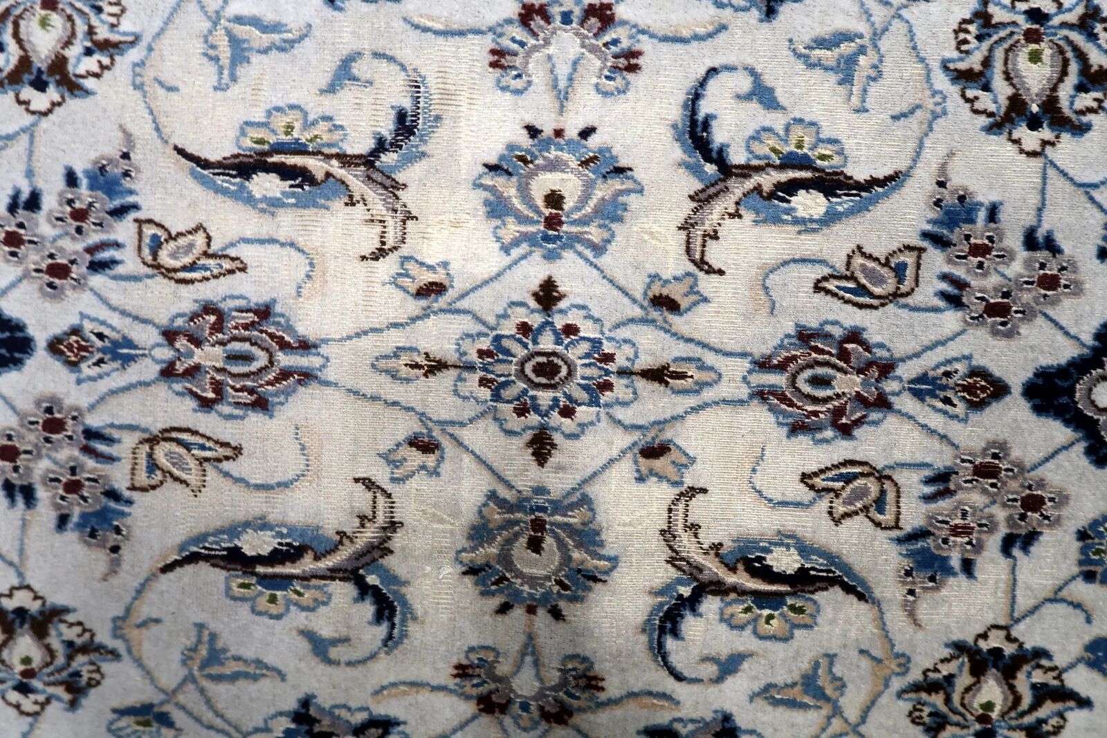 1950s hand-knotted wool rug with silk highlights, ivory and blue, 118 × 200 cm