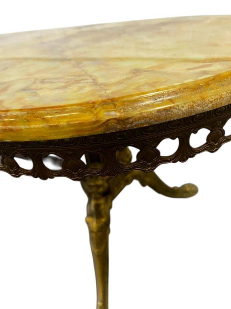 Vintage onyx coffee table with brass frame.