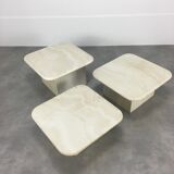 Three travertine trundle coffee tables