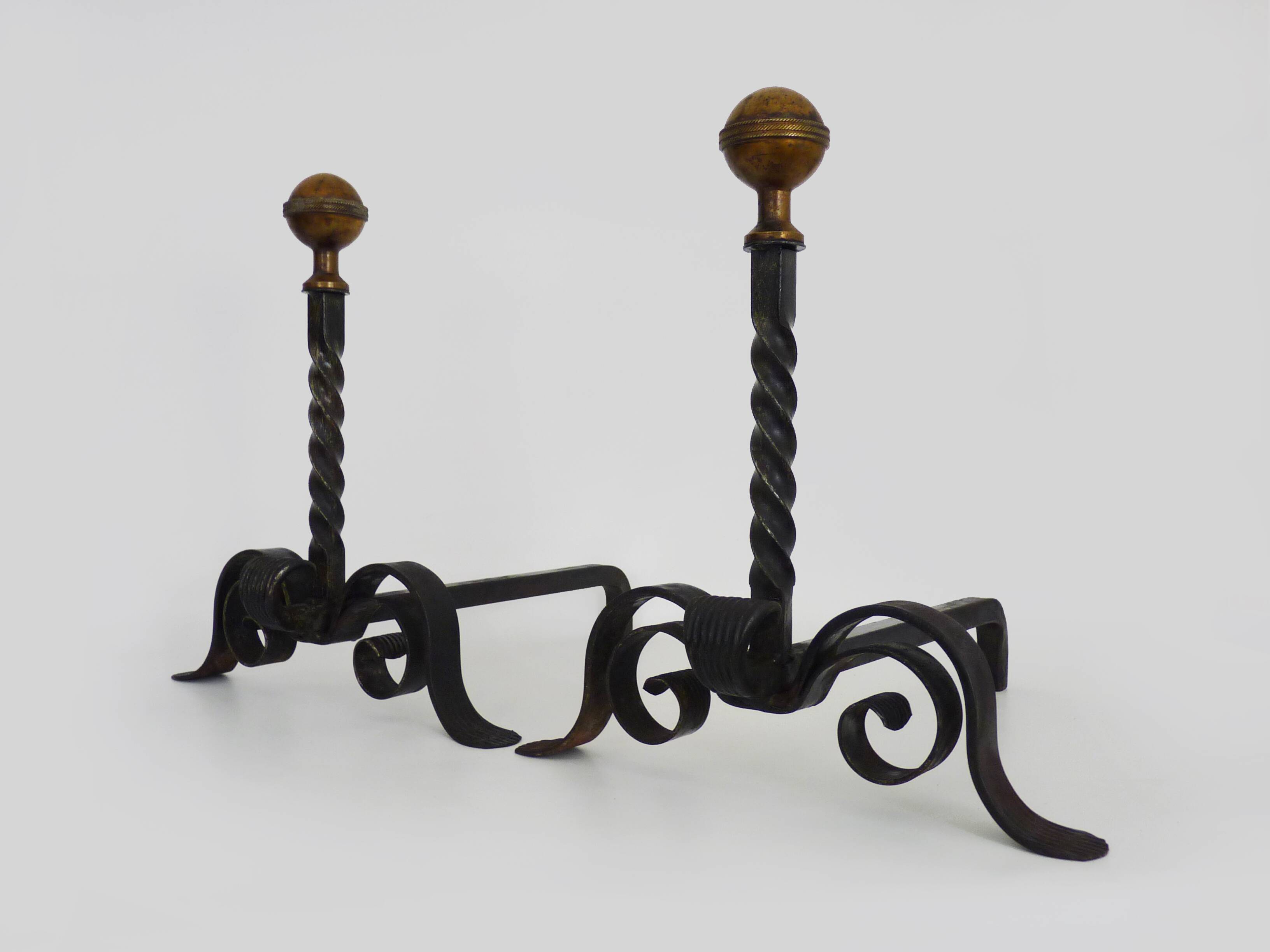 Large pair of wrought iron and brass ball fireplace andirons. 19th century