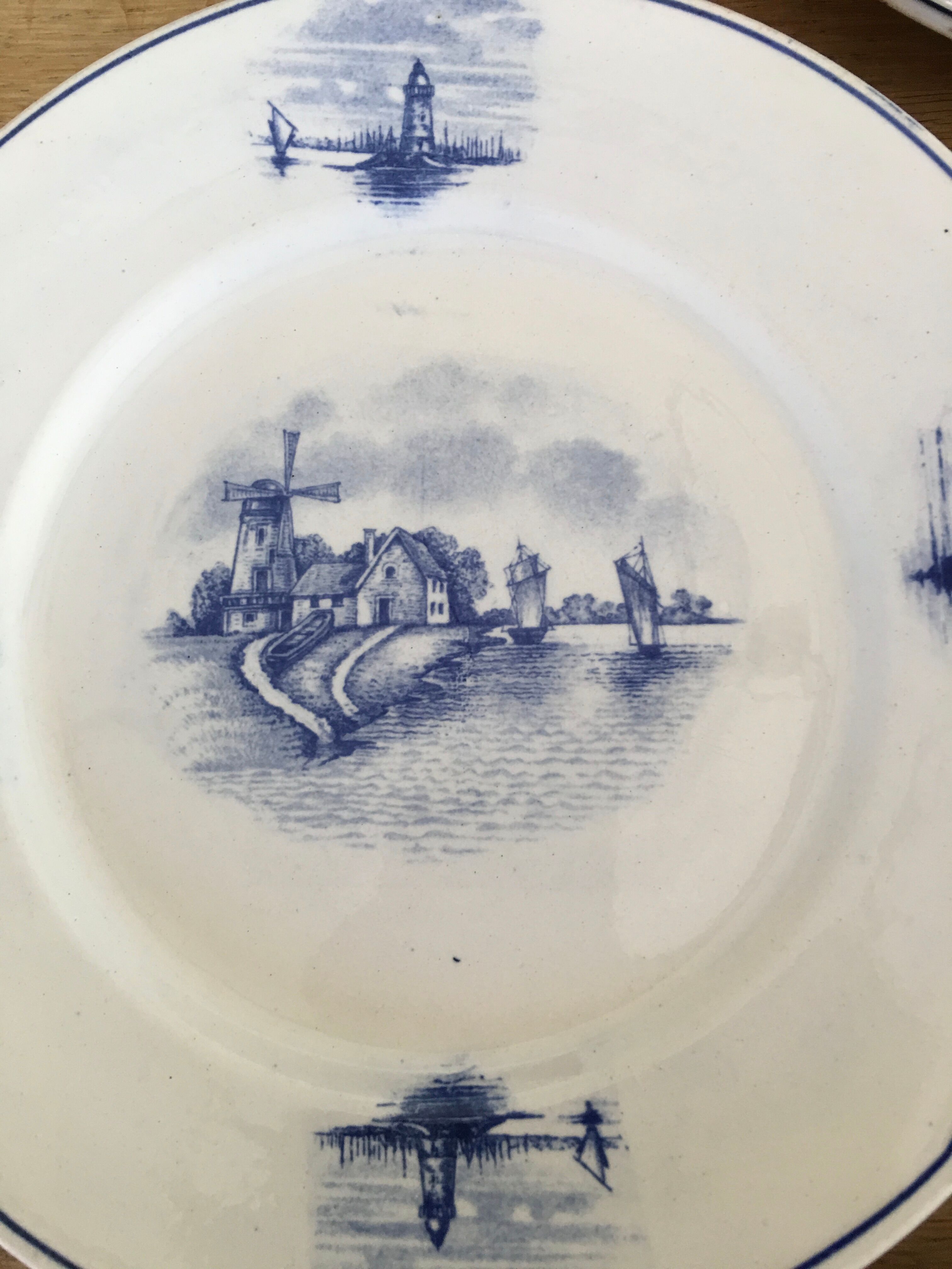 Series of 11 flat plates, Dutch earthenware, early XX