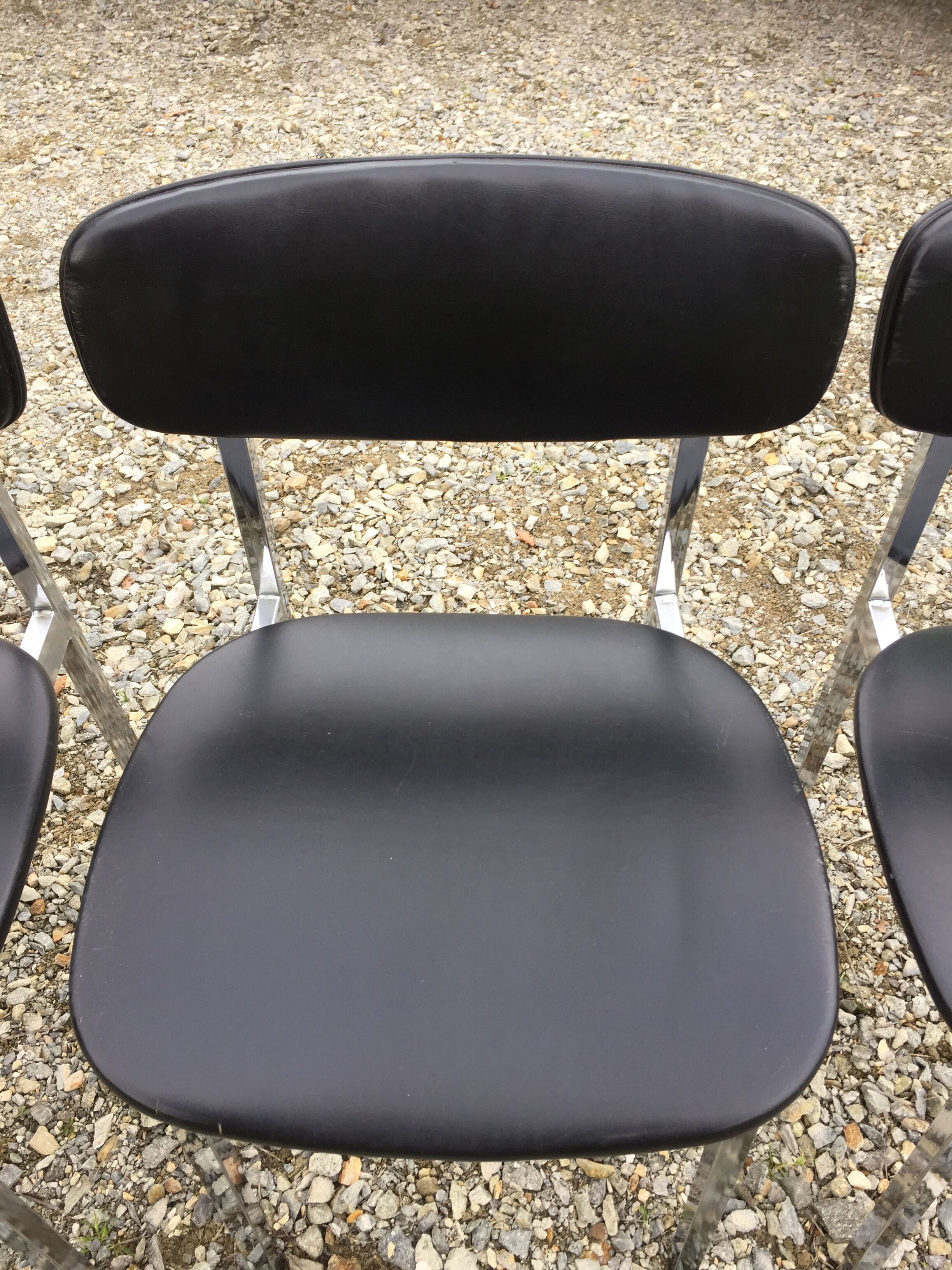 6 vintage chairs in black skaï with chrome metal tubular base.