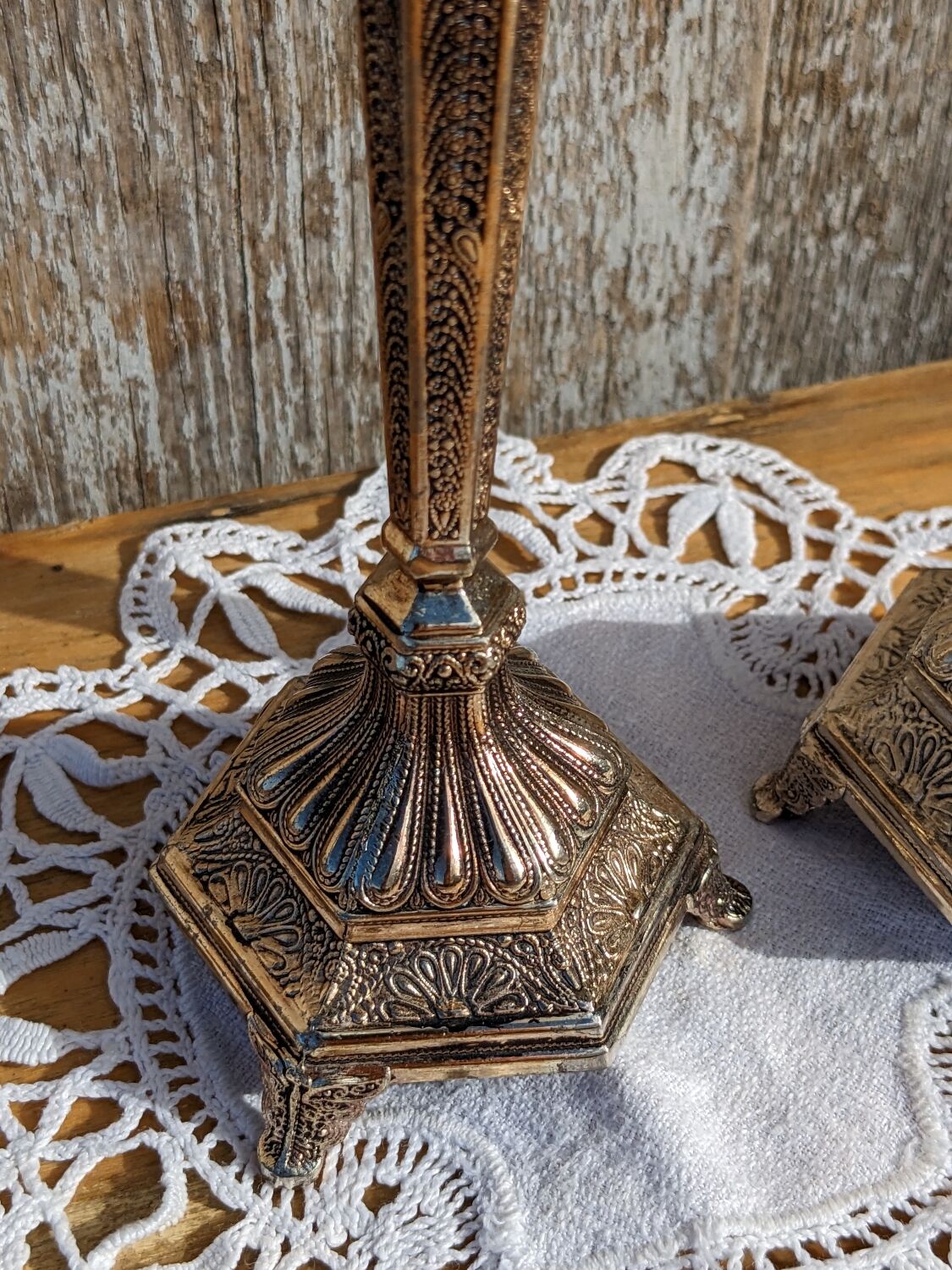 Pair of chiseled metal candle holders