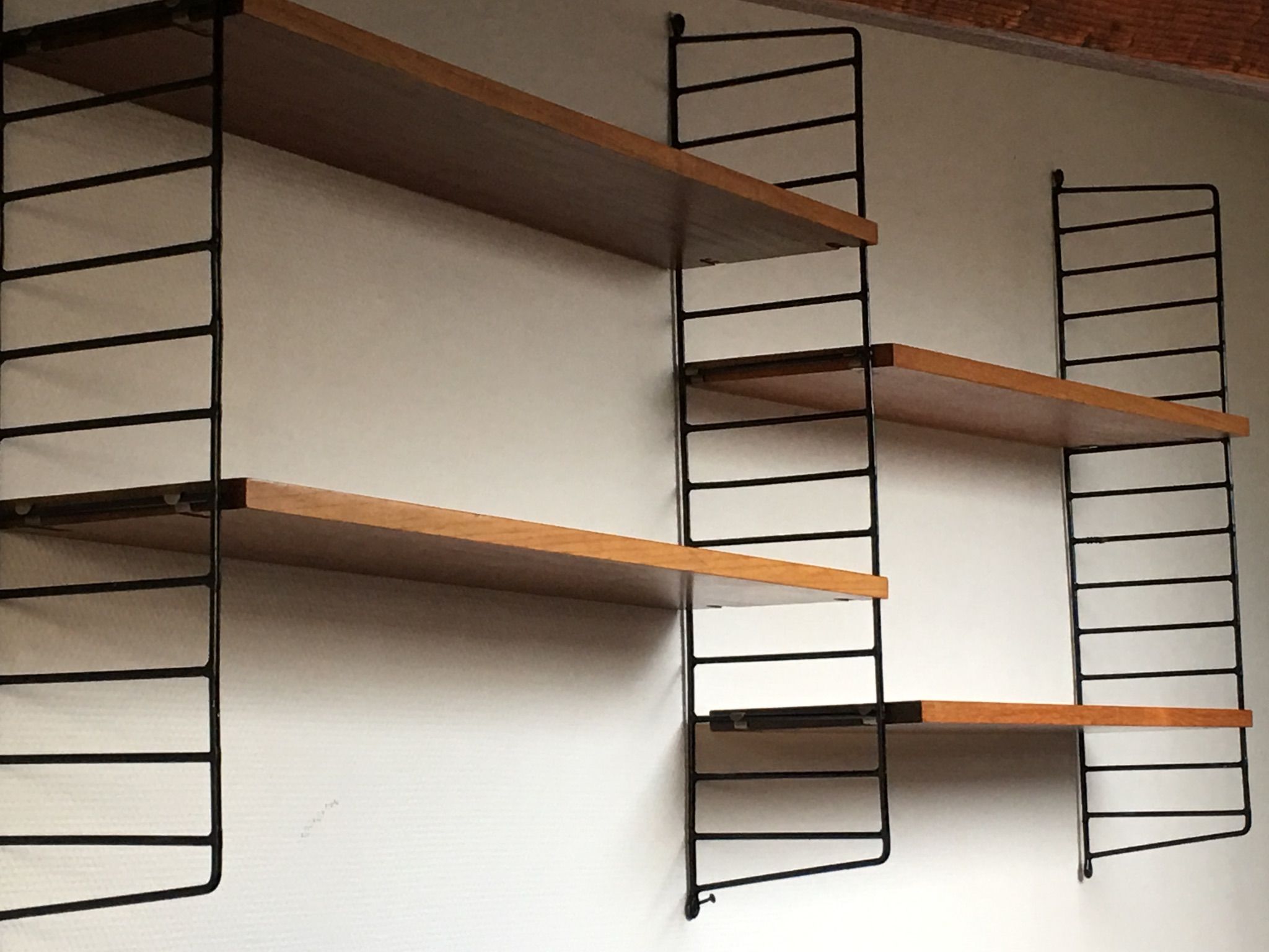 Shelf String icon of Scandinavian design designed by architect nils strinning and his wife kajsa